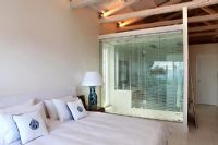 Modern bedroom with glass partition
