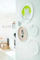 Collection of decorative plates on wall 