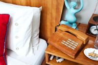 Wooden phone on bedside table 