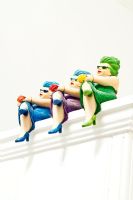 Detail of colourful figures on top of cupboard 