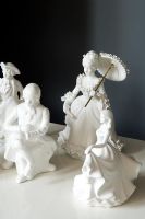 Display of white porcelain figures 