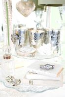 Silverware and jewellery on dressing table 
