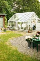 Country garden with greenhouse