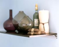 Bathroom accessories and toiletries on small shelf