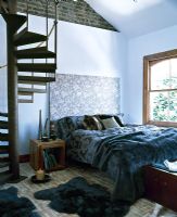 Modern bedroom with spiral staircase 