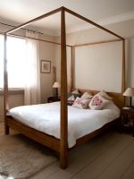 Wooden four poster bed