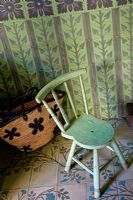 Vintage chair on decorative tiled floor 