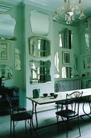 Display of mirrors on dining room wall 