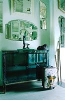 Sideboard with collection of mirrors