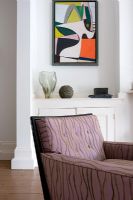 Armchair and painting in modern living room 