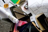 Architectural drawings and accessories on desk