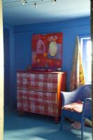 Blue bedroom with painted chest of drawers