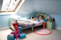 Christmas presents in modern childrens room 