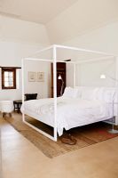 Modern bedroom with four poster bed