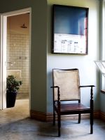 Vintage wicker chair in modern hallway 