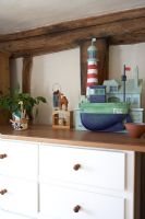 Wooden toys on chest of drawers 