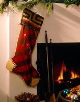 Christmas stocking hung by fireplace 