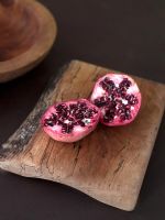 Detail of pomegranate on chopping board