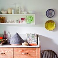 Sideboard and shelves of crockery and glassware