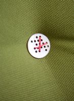 Detail of button on green cushion 