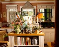 Country kitchen island full of collectibles 