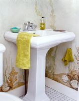 Classic bathroom sink and wall murals 