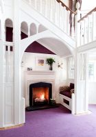 Snug with fireplace in country hallway 