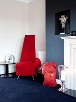 Modern living room with red chair