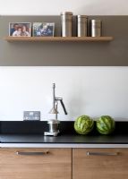 Detail of kitchen worktop with melons