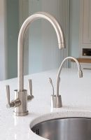 Detail of modern kitchen sink and taps