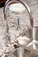 Detail of modern kitchen sink and tap 