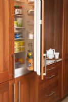 Open fridge in modern kitchen 