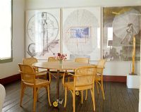 Modern dining room with wall of artwork 