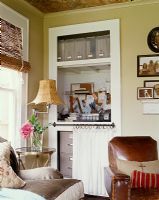 Country living room with alcove shelves 
