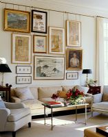 Classic living room with display of paintings 