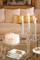 Cake and candles on coffee table 