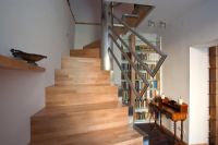Modern staircase and hallway with bookcase 
