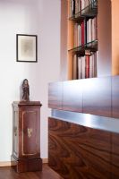 Sideboard and bookcase in hallway 