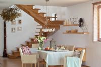 Spiral stairs in modern dining room 