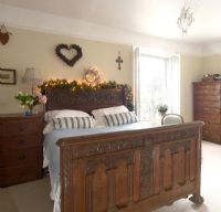 Classic bedroom decorated with fairy lights 
