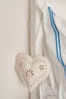 Heart shaped decoration on bed headboard 