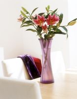 Vase of flowers on table 
