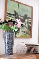 Classic vase of flowers on sideboard 