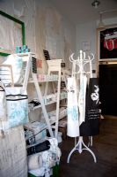 aprons and accessories on display in shop 