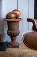 Vintage urn with wooden spheres 