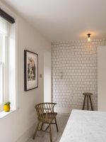 Brickwork style tiled wall in modern kitchen 