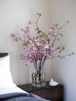 Flower arrangement on bedside table 