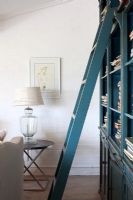 Ladder on bookshelf in classic living room 