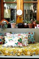 Detail of floral cushions on sofa 