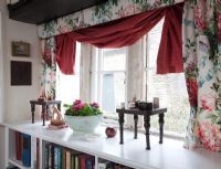 Floral curtains in country living room 